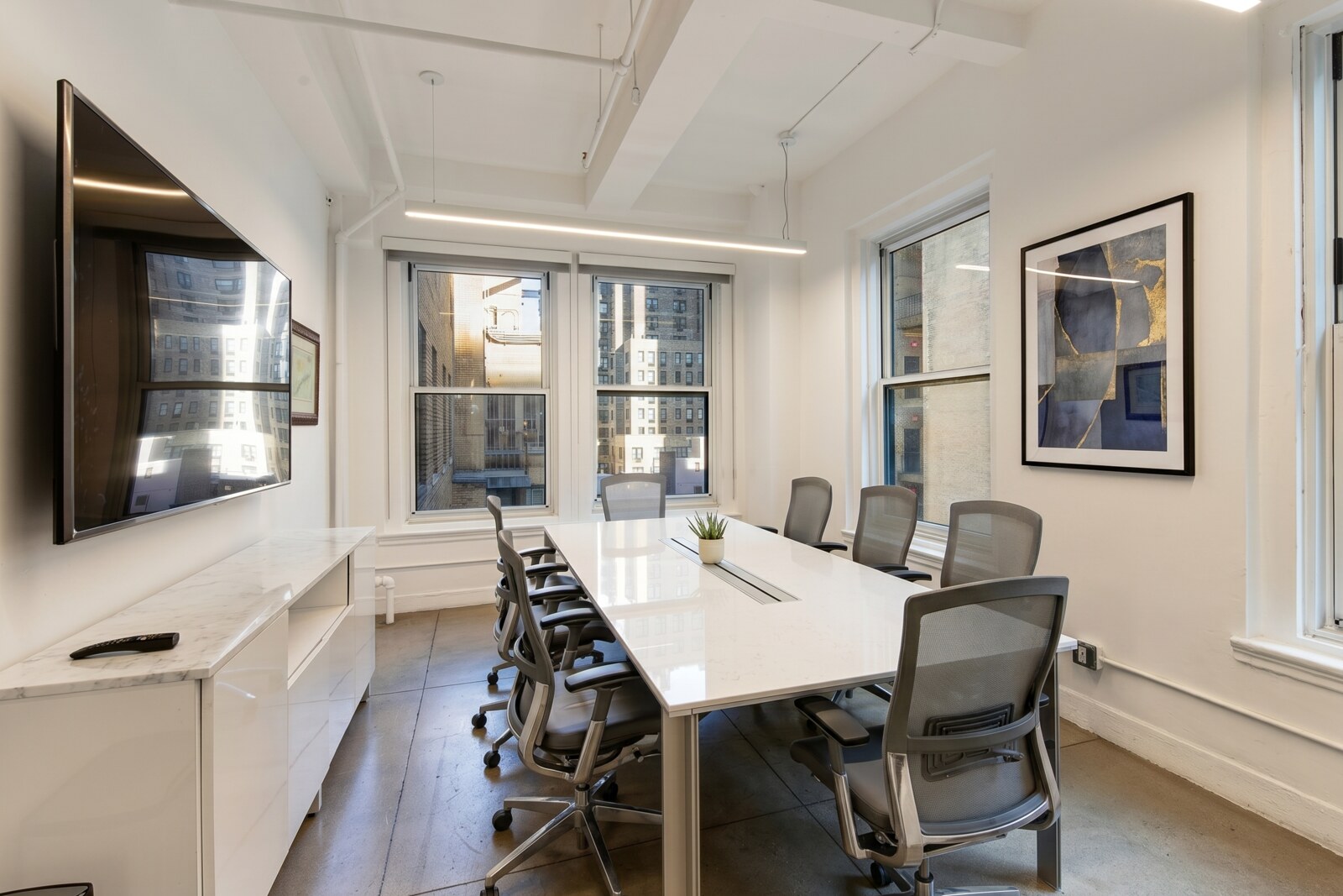A staged suite with conference room at 119 West 57th